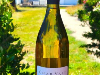 Chardonnay wine bottle outside in sunlight